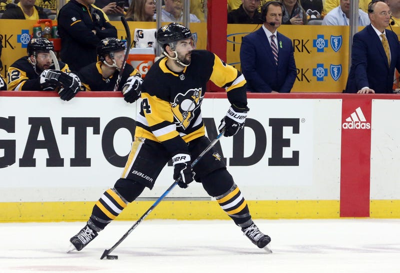 Pittsburgh Penguins defenseman Justin Schultz (4) handles the puck against the Washington Capitals during the first period in game six of the second round of the 2018 Stanley Cup Playoffs at PPG PAINT.