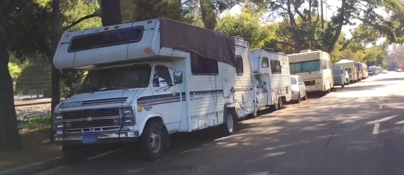 A row of RVs in Mountain View near the Caltrain tracks is not far from the new Google headquarters that is under construction.