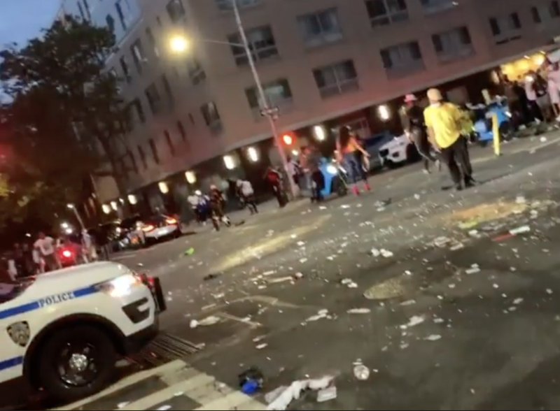 crowd throwing bottles in harlem