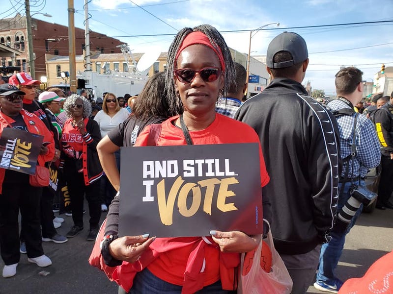 An attendee is shown at the 55 year observance of the March for Voter Rights in Selma, ALhts in