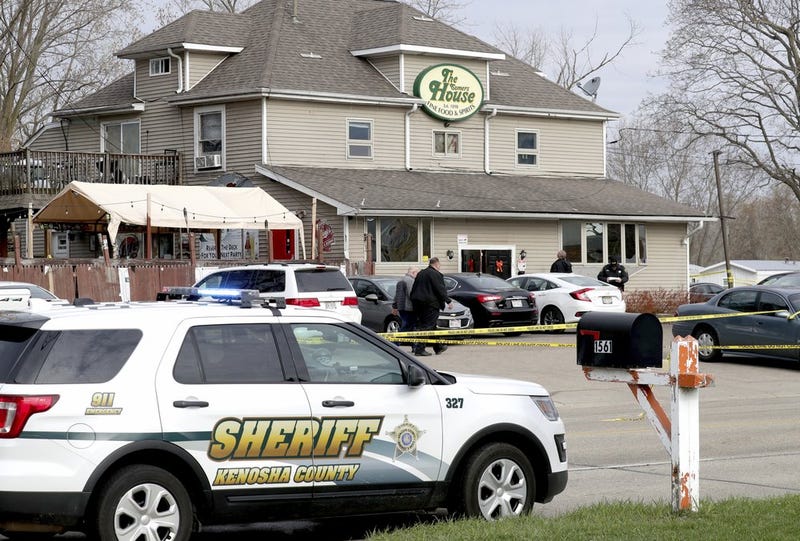 Officials investigate the scene a deadly shooting at Somers House Tavern in Kenosha, Wis., Sunday, April 18, 2021. Several people were killed and two were seriously wounded in a shooting at the busy tavern in southeastern Wisconsin early Sunday, sheriff's officials said.