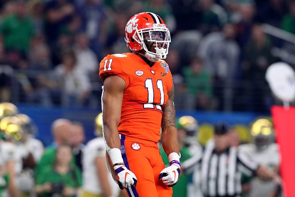 Isaiah Simmons flexes after a big play for Clemson.