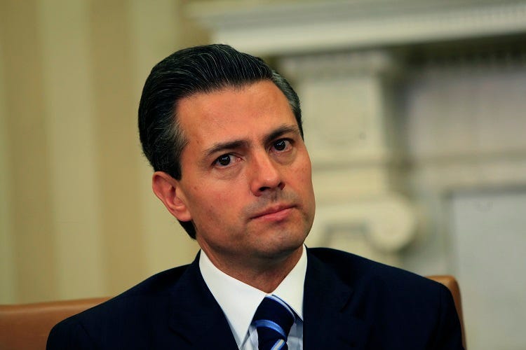 President Barack Obama meets with President Enrique Peña Nieto of Mexico in the Oval Office on January 6, 2015. (Photo by Dennis Brack/Pool) *** Please Use Credit from Credit Field