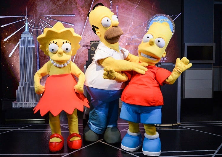 Simpsons Costumed characters, participate in the ceremonial lighting of the Empire State Building as they attend the Empire State Building Celebration of the 30th Anniversary of FOX's "The Simpsons" on December 17, 2018 in New York City. (Photo by Anthon