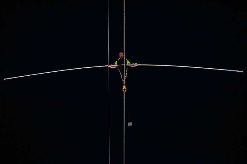 Arialist Nick Wallenda walks on a high wire across Times Square in New York