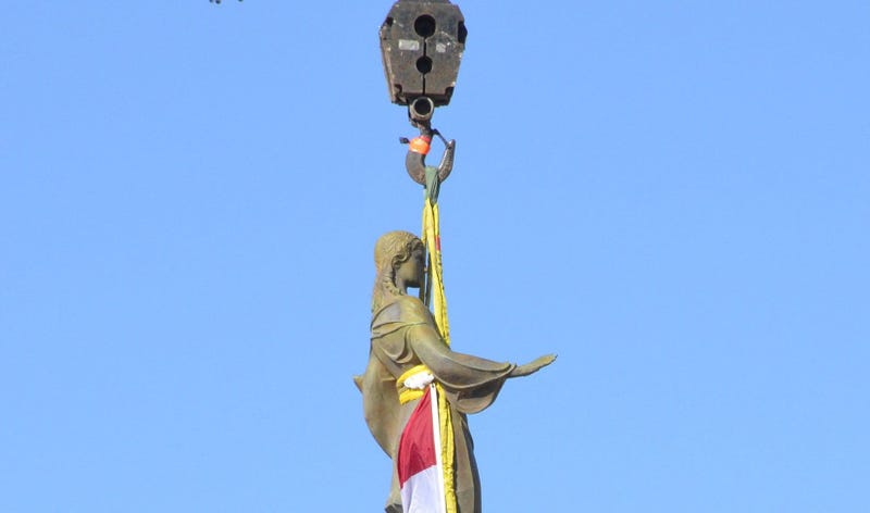 A statue of Ceres, the Roman goddess of agriculture, descends from the top of the Missouri Capitol to the grounds on Nov. 15, 2018. (Photo by Jack Suntrup/St. Louis Post-Dispatch/TNS/Sipa USA)
