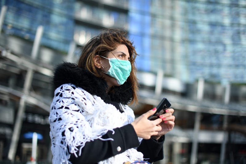 A woman wears a face mask in Milan, Italy, Feb. 26, 2020.