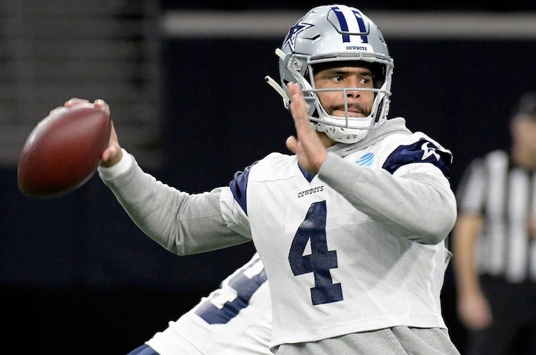 Dak Prescott throwing football