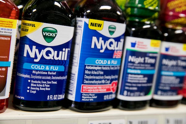 Bottles of NyQuil on a shelf