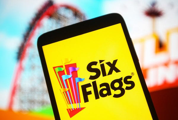 The Six Flags logo is seen on a smartphone screen