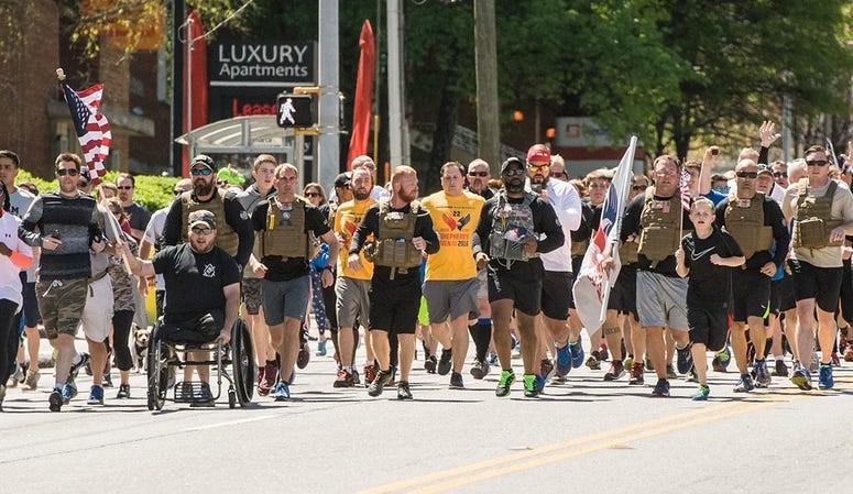 Shepherd's Men runners are joined by the crowd during a run.