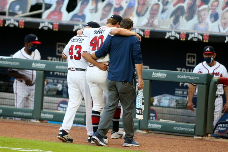 Braves' Mike Soroka is helped off the field