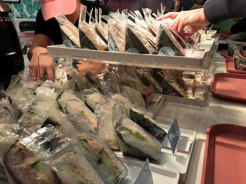Customers reach for musubi at Hapa Musubi