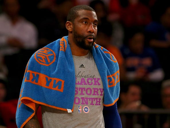 Amar'e Stoudemire watches from the Knicks' bench.