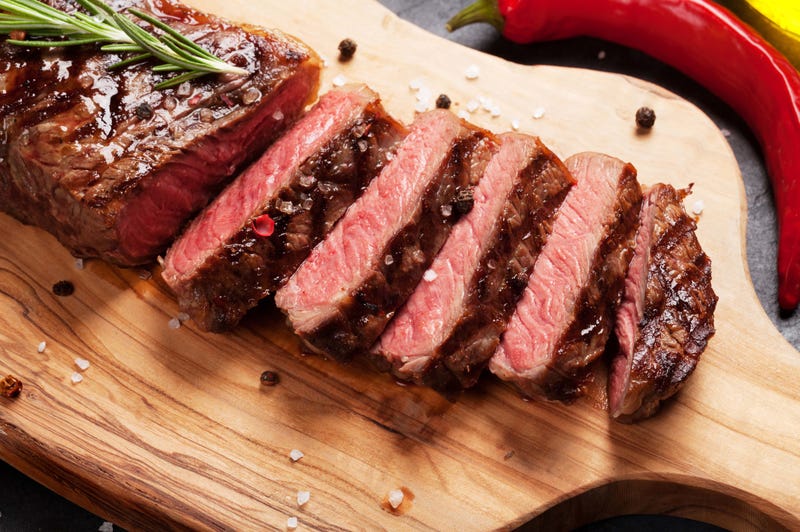 A steak cut up on a platter