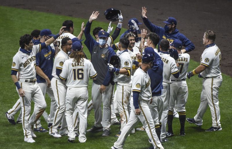 Brewers celebrate after game one walk off sac fly