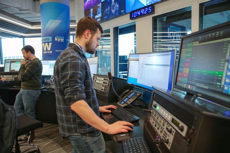 News production assistant Phillip Casey and writer Conner Barkon man the new KYW Newsradio editor's desk at 2400 Market.