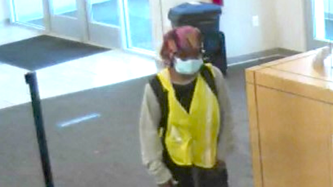 Glenesha Currie allegedly robs a Fifth-Third Bank branch Aug. 13 in suburban Summit.