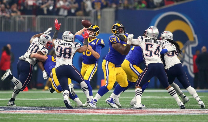 Los Angeles Rams quarterback Jared Goff (16) throws a pass against the New England Patriots in the third quarter in Super Bowl LIII at Mercedes-Benz Stadium.