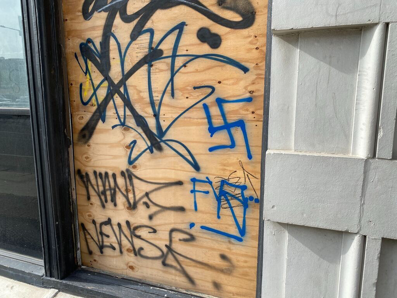 A swastika is spray-painted on an empty building at 23rd and Market streets
