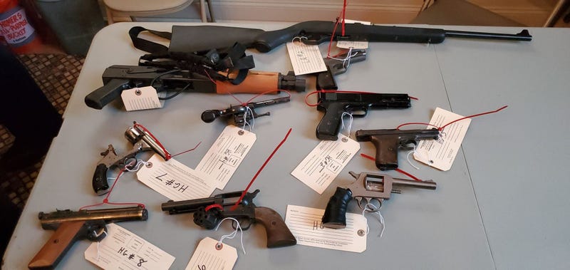 Guns collected at Taylor Memorial Baptist Church as part of a giveback event.