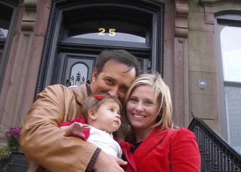 Dennis, Kara and Helena House in front of their historic brownstone at 25 Capitol Avenue in Hartford.