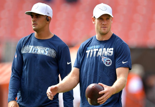Marcus Mariota and Ryan Tannehill warm up for the Titans.