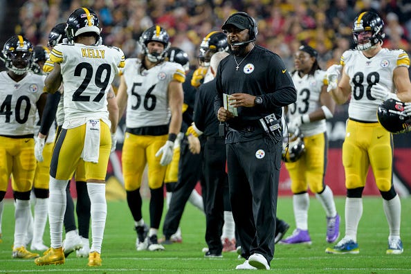 Steelers coach Mike Tomlin fires up his team during a timeout.