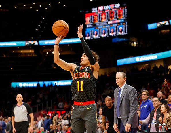 Trae Young fires a 3-pointer in a double-overtime game vs. the Knicks.
