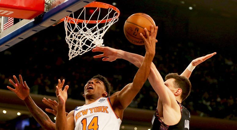 Knicks guard Allonzo Trier goes up for a shot and is fouled by Brooklyn Nets forward Rodions Kurucs on Dec. 8, 2018, at Madison Square Garden.
