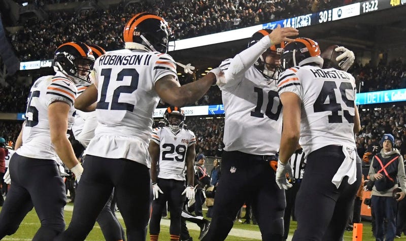 Bears quarterback Mitchell Trubisky (10) celebrates with teammates after scoring on a touchdown run against the Cowboys.