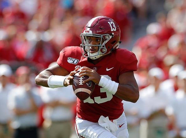 Tua Tagovailoa looks to make a pass against Ole Miss.