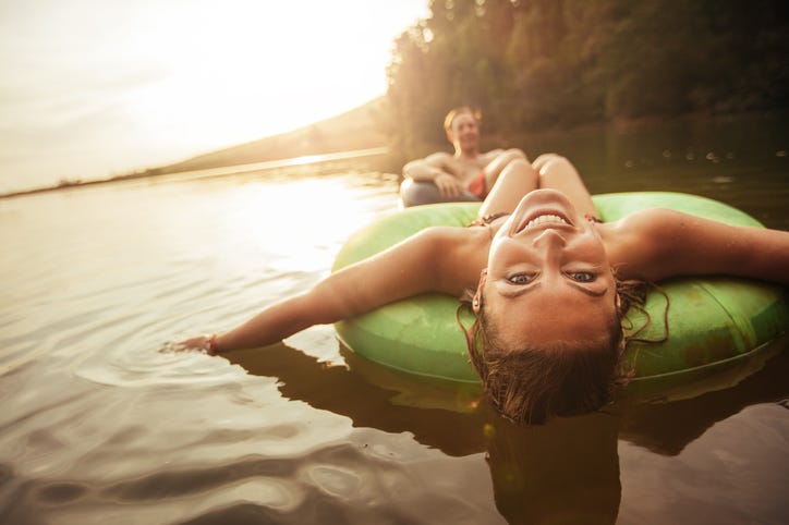 Woman in Inner Tube On The River