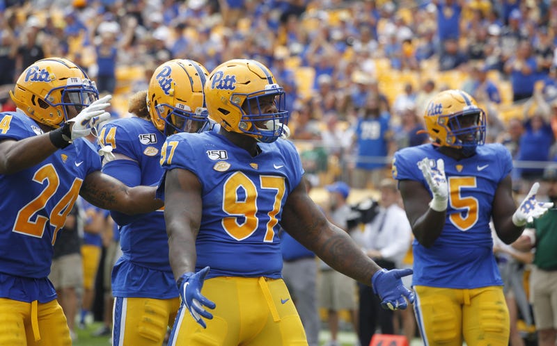 Pittsburgh Panthers linebacker Phil Campbell III (24) and linebacker Elias Reynolds (44) and defensive lineman Jaylen Twyman (97) and defensive lineman Deslin Alexandre (5) celebrate a defensive stop ...
