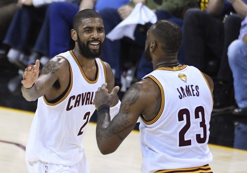 Cleveland Cavaliers guard Kyrie Irving (2) celebrates with forward LeBron James (23) during the third quarter against the Golden State Warriors in game three of the 2017 NBA Finals at Quicken Loans Arena.
