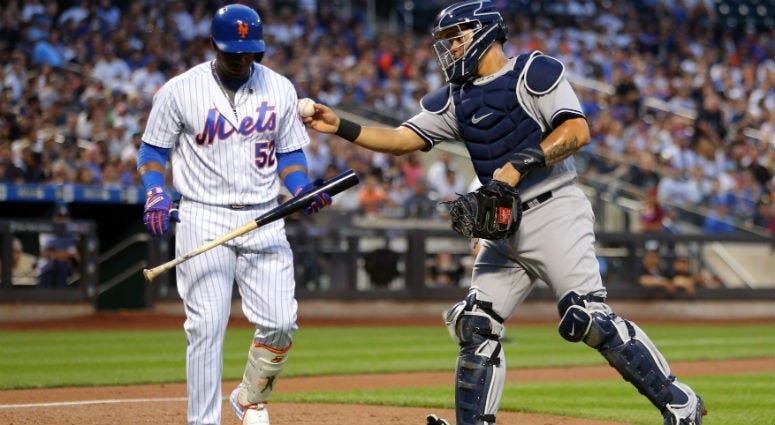 Gary Sanchez tags out Yoenis Cespedes after a dropped third strike during the first inning at Citi Field.
