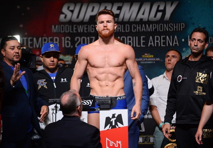Canelo Alvarez weighs in for his upcoming bout against Gennady Golovkin (not pictured) during weigh-ins at MGM Grand Garden Arena.