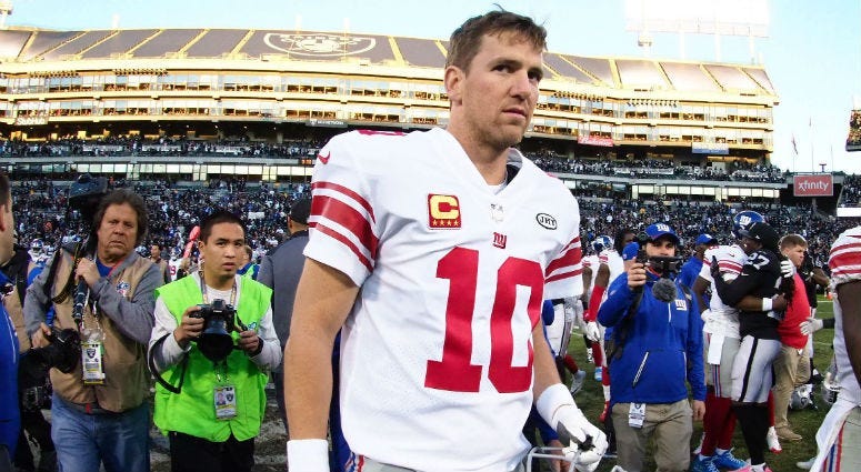 Eli Manning leaves the field after the loss against the Oakland Raiders at Oakland Coliseum.