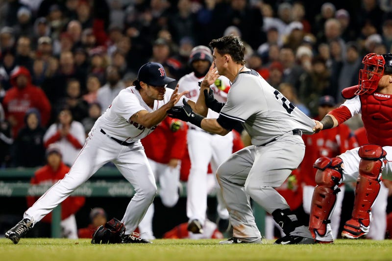 Tyler Austin charges the mound on Joe Kelly