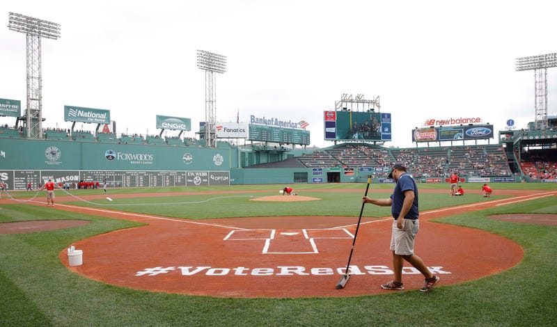 Jun 24, 2018; Boston, MA, USA; Fenway Park grounds crew prep a sign at home play for MLB Allstar voting before the start of the game against the Seattle Mariners.