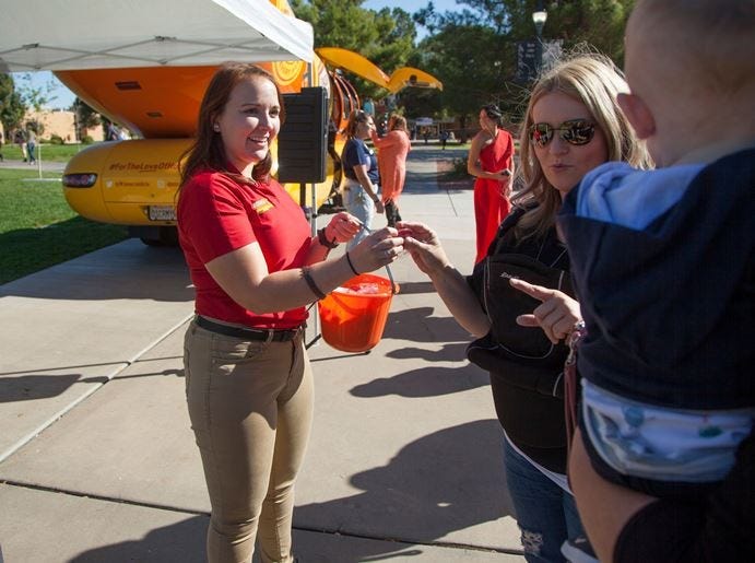 Dixie State University students and members of the community visit the Oscar Mayer Wienermobile at DSU Tuesday, Oct. 30, 2018