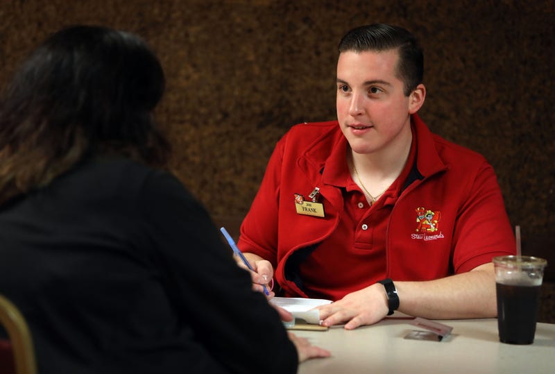 Human resources specialist Frank DeSantis interviews an applicant during the holiday jobs fair at Stew Leonard's in Yonkers Nov. 6, 1018