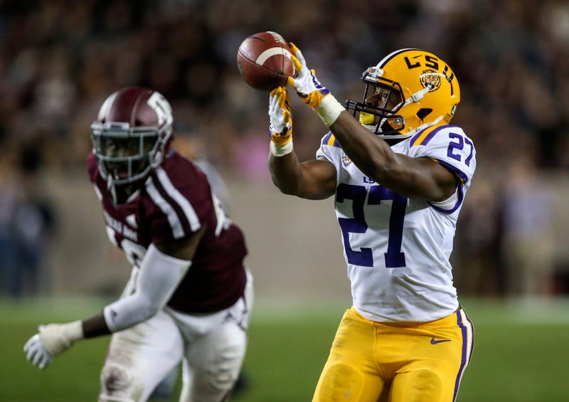 LSU Tigers running back Lanard Fournette (27) is unable to make a reception as Texas A&M Aggies linebacker Otaro Alaka (42) defends during the third quarter at Kyle Field.