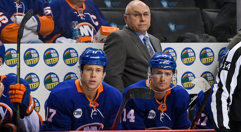 Barry Trotz looks on from behind the bench against the Washington Capitals during the third period at Barclays Center.