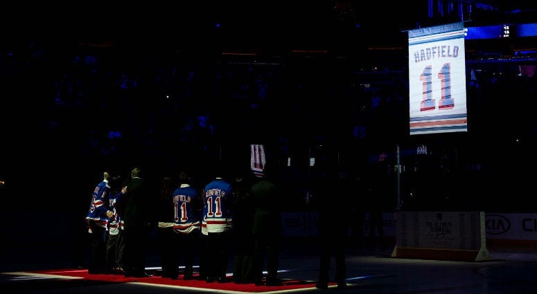 The banner for Vic Hadfield is raised during the jersey retirement for Vic Hadfield at Madison Square Garden.