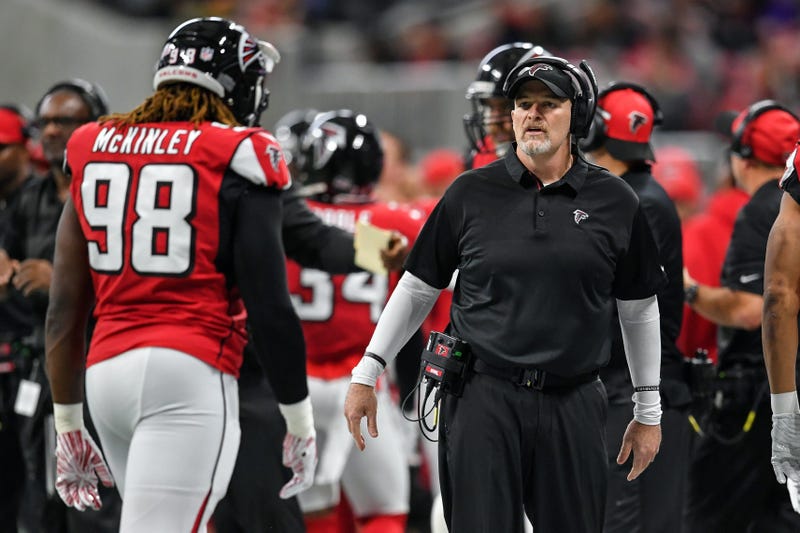 Dec 16, 2018; Atlanta, GA, USA; Atlanta Falcons head coach Dan Quinn reacts with defensive end Takkarist McKinley (98) on the sideline against the Arizona Cardinals during the first half at Mercedes-Benz Stadium. Mandatory Credit: Dale Zanine-USA TODAY Sp