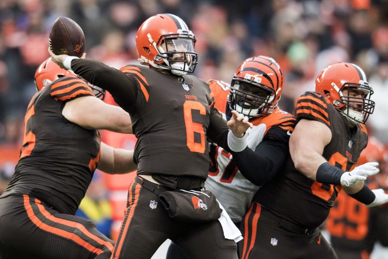Dec 23, 2018; Cleveland, OH, USA; Cleveland Browns quarterback Baker Mayfield (6) throws a pass as Cincinnati Bengals defensive tackle Geno Atkins (97) rushes during the second half at FirstEnergy Stadium. Mandatory Credit: Ken Blaze-USA TODAY Sports