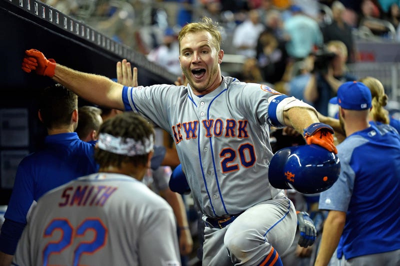 New York Mets first baseman Pete Alonso (20) celebrates in the dugout after hitting a three run homer in the ninth inning against the Miami Marlins at Marlins Park.