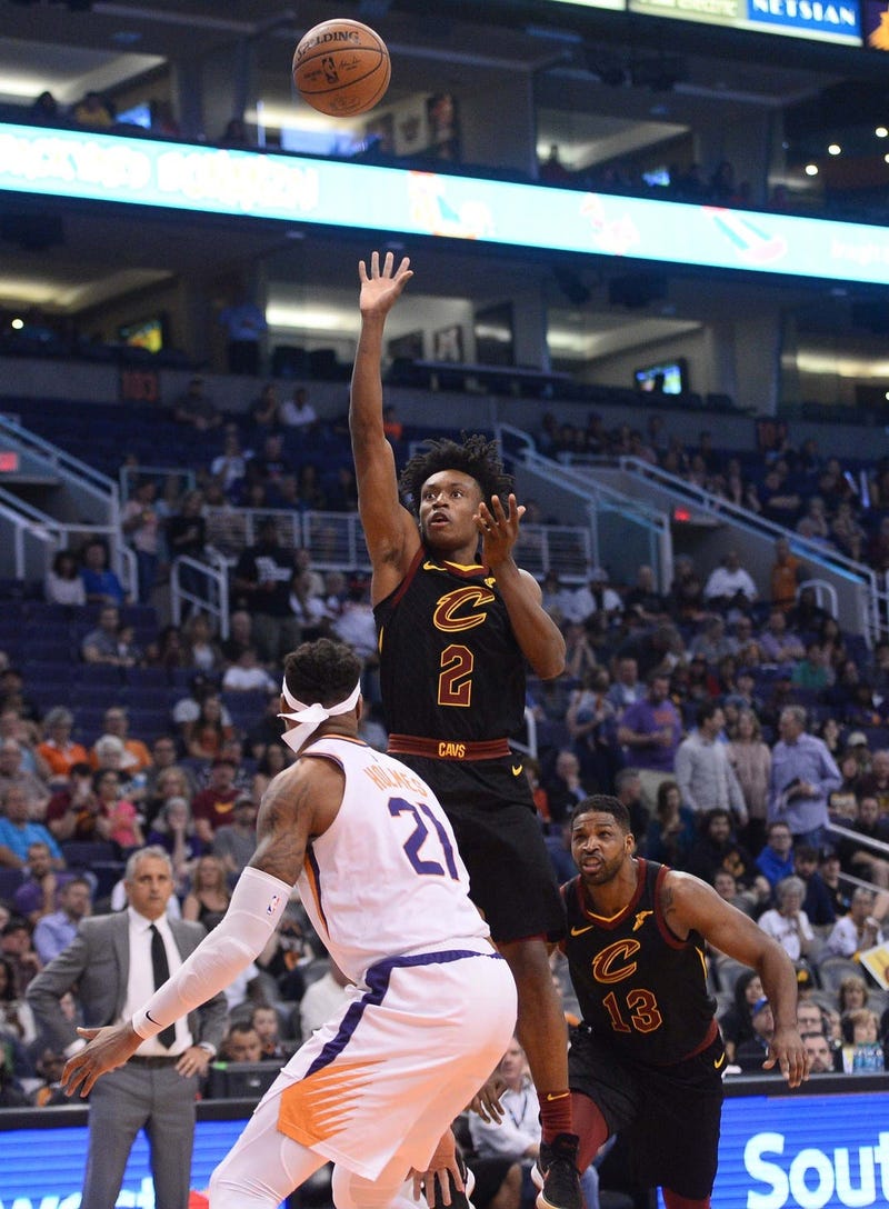 Cleveland Cavaliers guard Collin Sexton (2) shoots over Phoenix Suns forward Richaun Holmes (21) during the first half at Talking Stick Resort Arena.