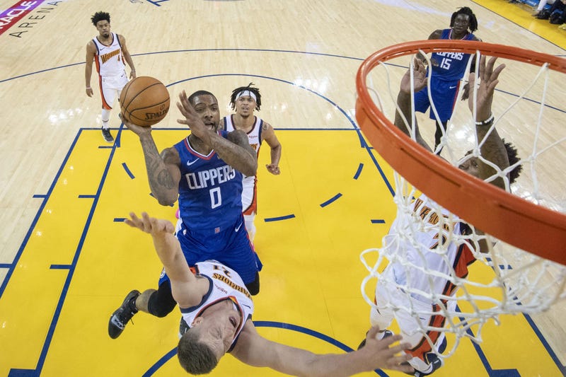 April 7, 2019; Oakland, CA, USA; LA Clippers guard Sindarius Thornwell (0) shoots the basketball against Golden State Warriors forward Jonas Jerebko (21) during the second half at Oracle Arena. Mandatory Credit: Kyle Terada-USA TODAY Sports